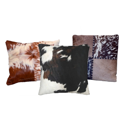 Cluster of (3) Cowhide Pillows